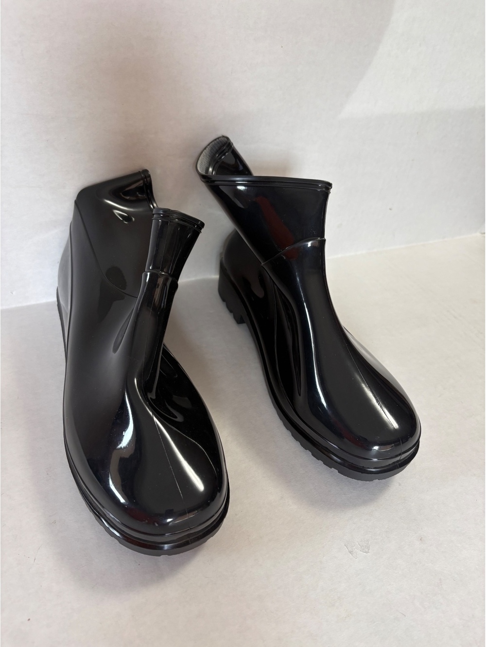 Woman’s black ankle rain boots